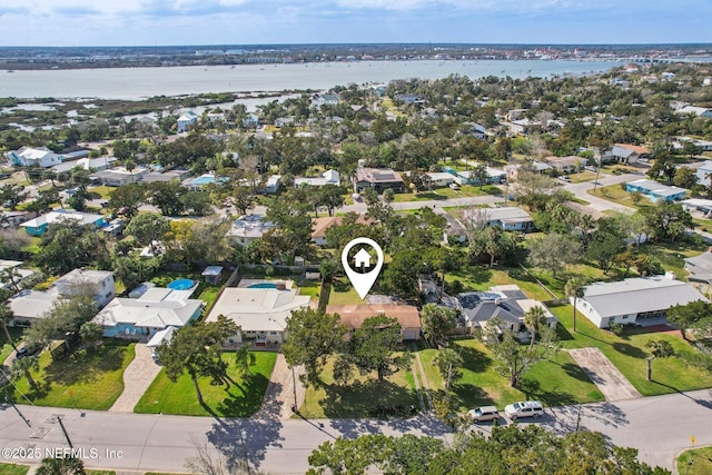 birds eye view of property with a residential view and a water view