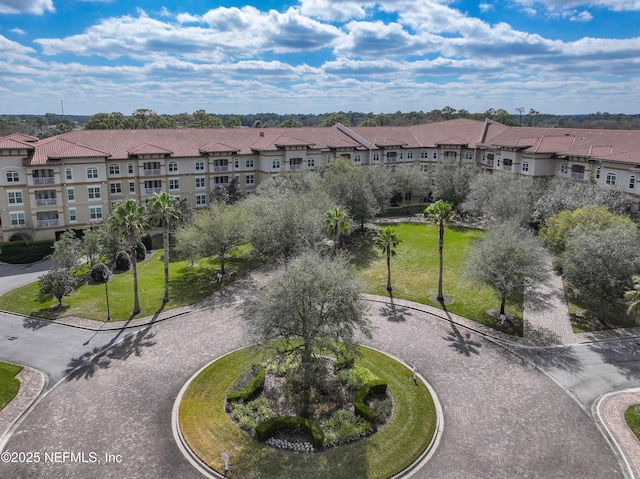 view of community with a residential view and a lawn