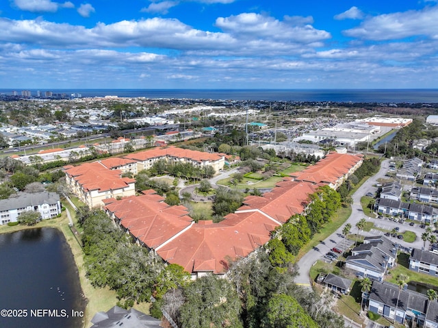 bird's eye view featuring a residential view and a water view