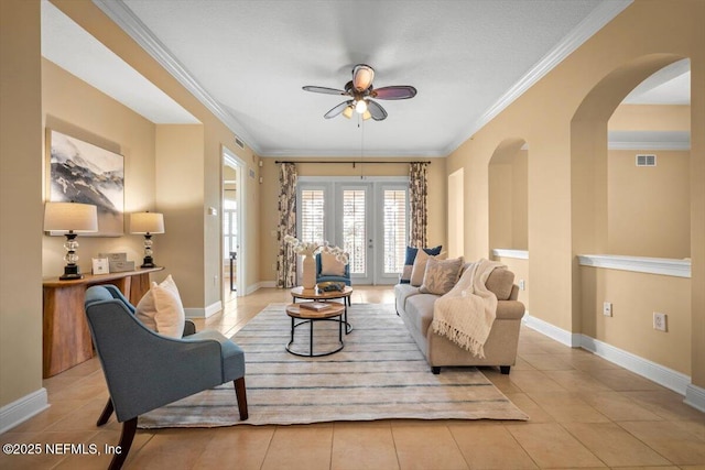 living area featuring ornamental molding, visible vents, and baseboards