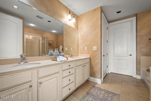 full bath with tile patterned flooring, a sink, a shower stall, a bath, and double vanity