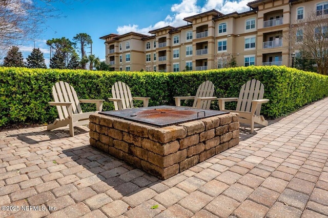 view of patio / terrace featuring a fire pit