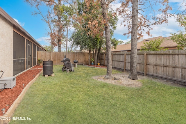 view of yard with a sunroom