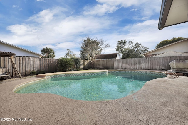 view of swimming pool featuring a patio, a fenced backyard, and a fenced in pool