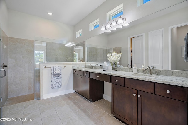 95384 Bermuda Dr, Fernandina Beach, FL 32034 - full bathroom featuring double vanity, tile patterned floors, a sink, and a walk in shower