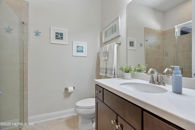 95384 Bermuda Dr, Fernandina Beach, FL 32034 - full bath with toilet, vanity, baseboards, tile patterned flooring, and tiled shower