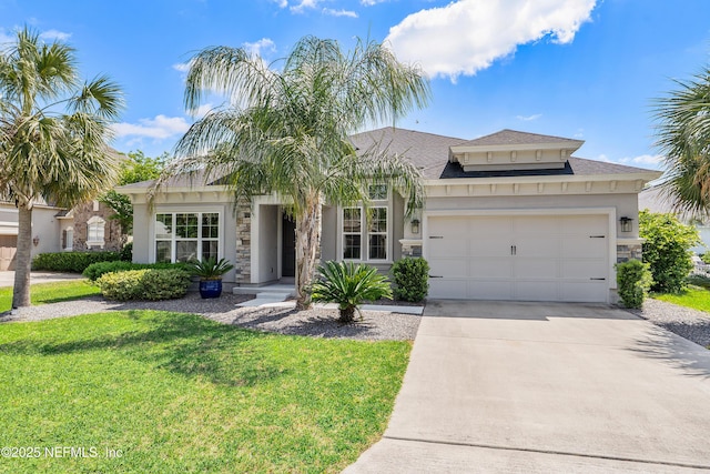 95384 Bermuda Dr, Fernandina Beach, FL 32034 - view of front of property featuring a front lawn, driveway, stone siding, an attached garage, and stucco siding
