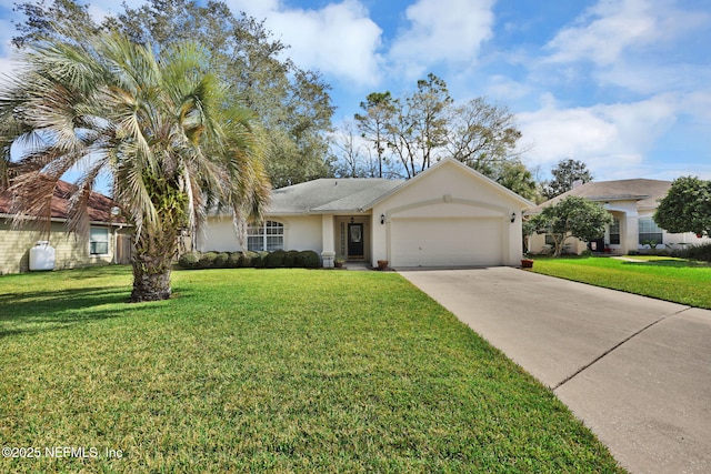 view of front of house with a front yard, driveway, an attached garage, and stucco siding