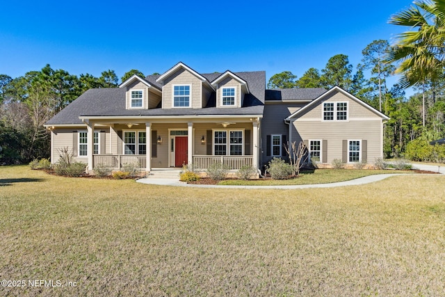 view of front of property featuring covered porch and a front lawn