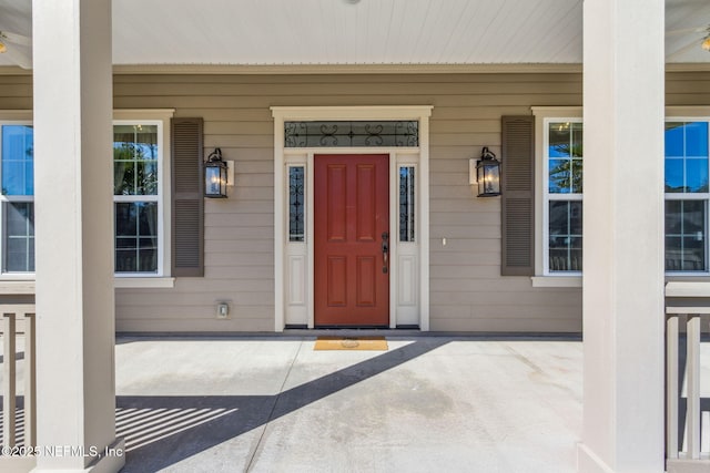 doorway to property featuring a porch