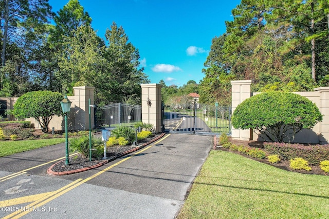 view of gate featuring fence