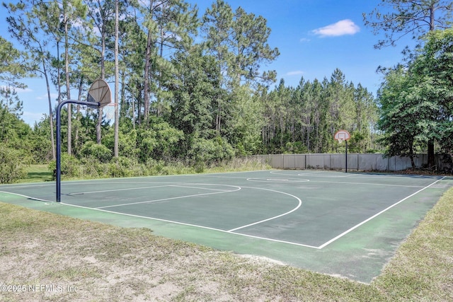 view of sport court featuring community basketball court and fence