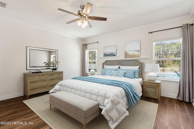 bedroom with dark wood-style flooring, ornamental molding, and multiple windows