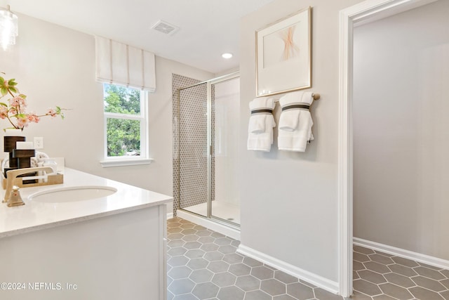 bathroom with vanity and walk in shower