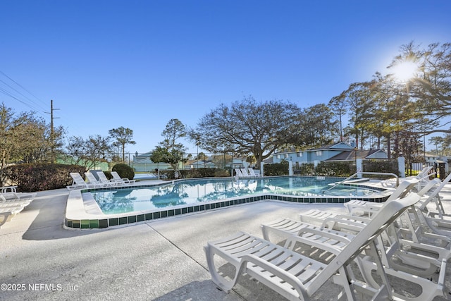 community pool with a patio