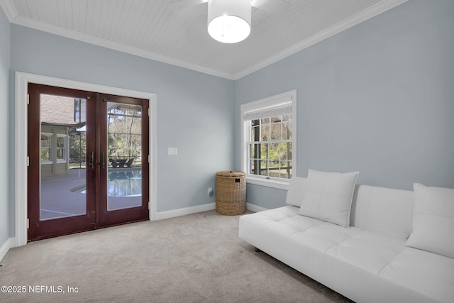 living area with french doors, light carpet, crown molding, and baseboards