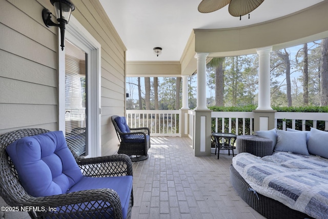 view of patio featuring covered porch and a ceiling fan