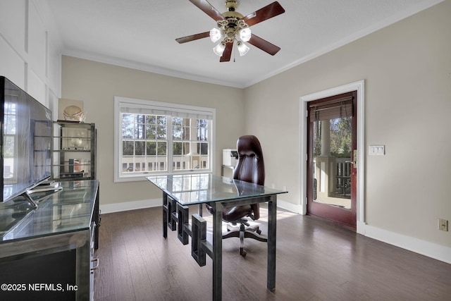 home office with ceiling fan, baseboards, dark wood-type flooring, and crown molding