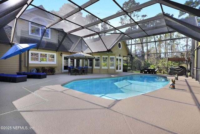 pool with a patio area and a lanai