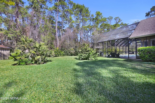 view of yard featuring a lanai