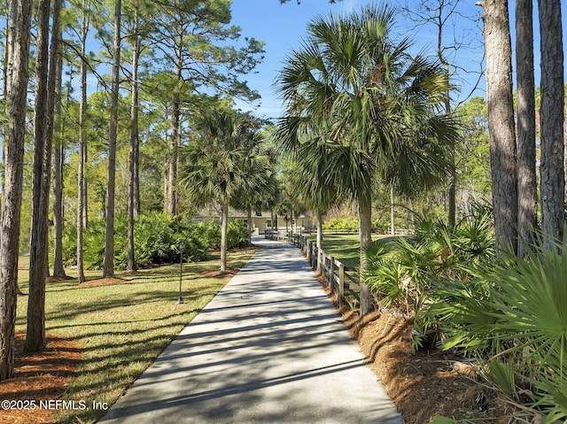 surrounding community featuring a yard