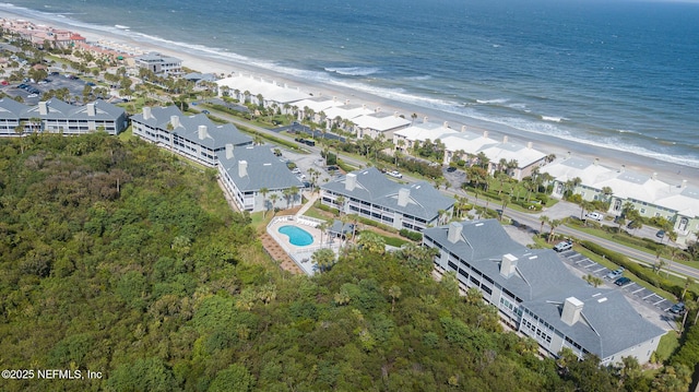 aerial view with a beach view, a water view, and a residential view