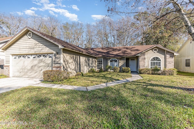 ranch-style home with a front lawn, an attached garage, brick siding, and driveway