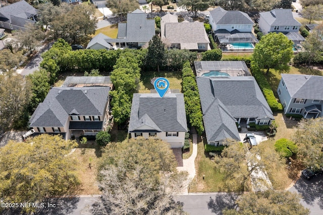 birds eye view of property with a residential view