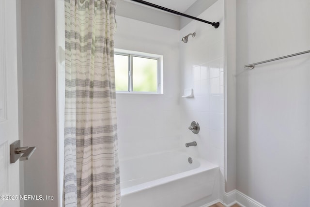 bathroom featuring shower / bath combination with curtain