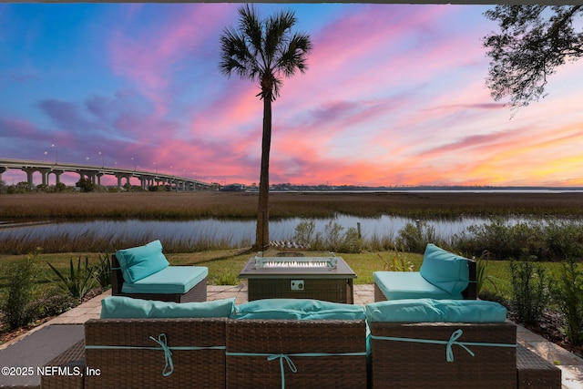 view of patio / terrace featuring a water view and an outdoor hangout area