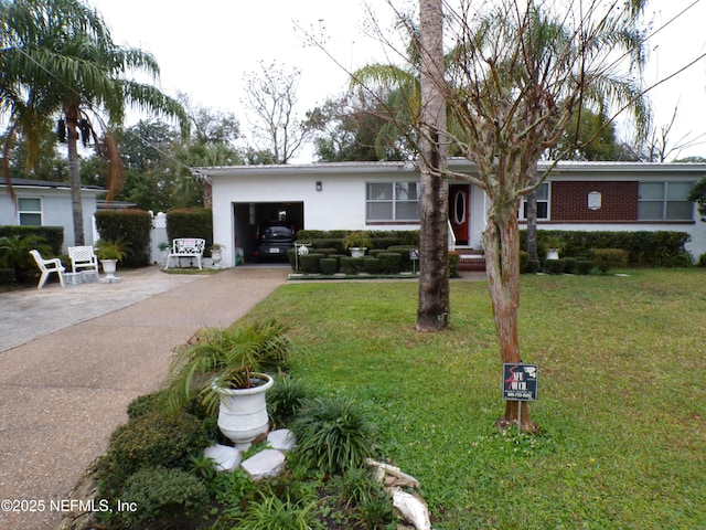 ranch-style home featuring a garage, concrete driveway, brick siding, and a front lawn