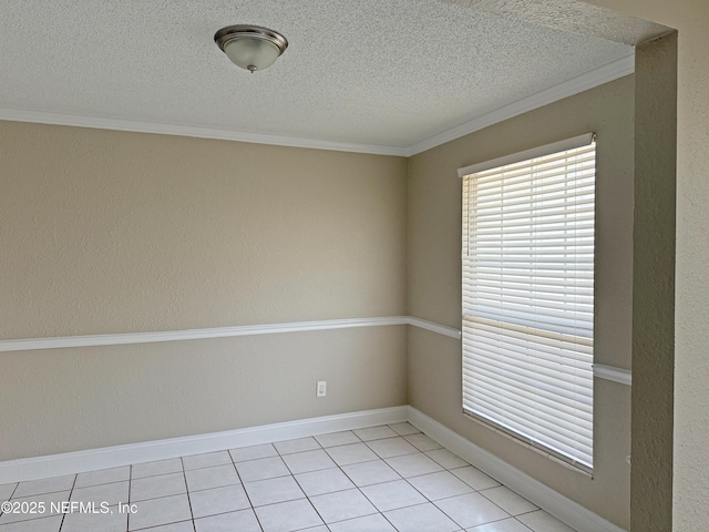 empty room with a textured wall, crown molding, a textured ceiling, and baseboards