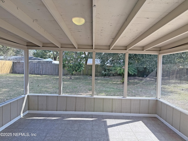 unfurnished sunroom featuring a wealth of natural light