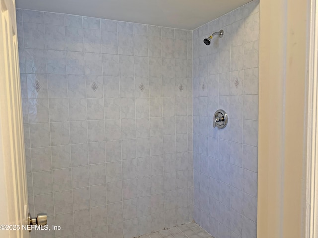 full bath featuring tiled shower