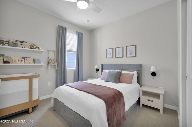 bedroom with a ceiling fan, carpet, and baseboards