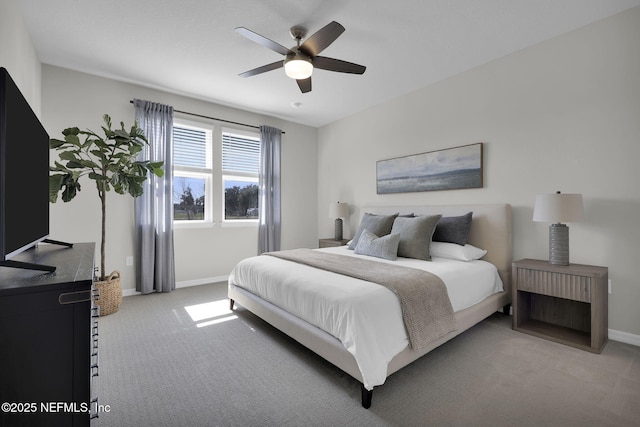 bedroom featuring ceiling fan, baseboards, and light colored carpet