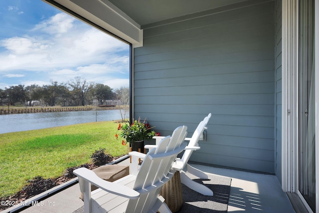 view of patio with a water view