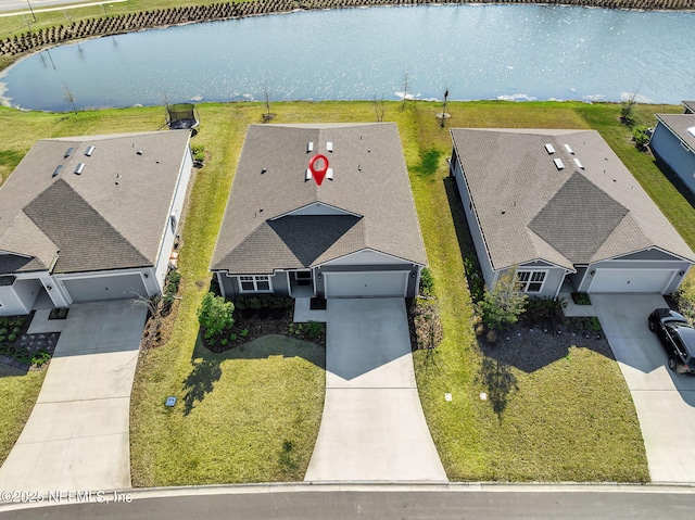 birds eye view of property featuring a water view