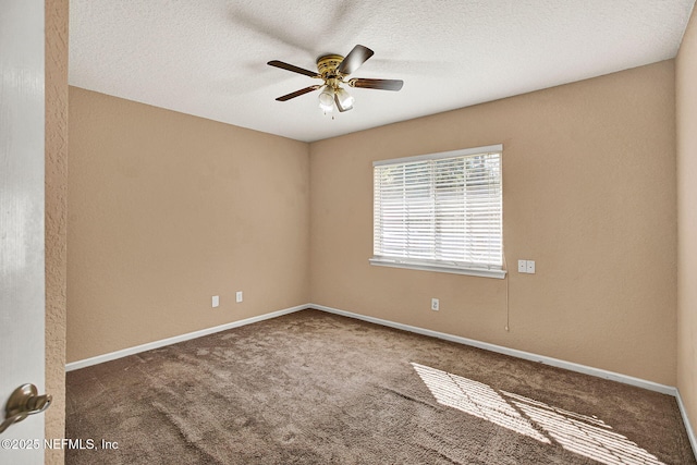 carpeted empty room with ceiling fan and a textured ceiling