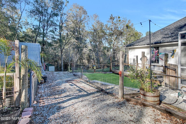 view of yard featuring a garage