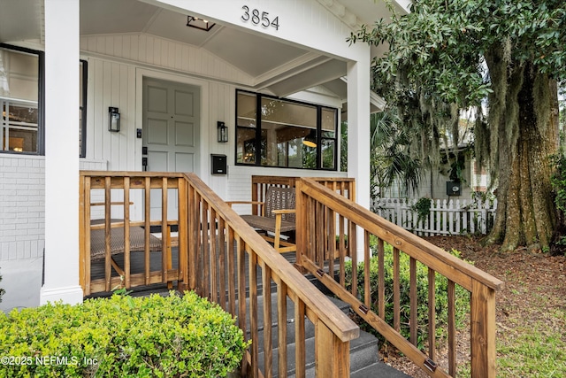 doorway to property featuring brick siding