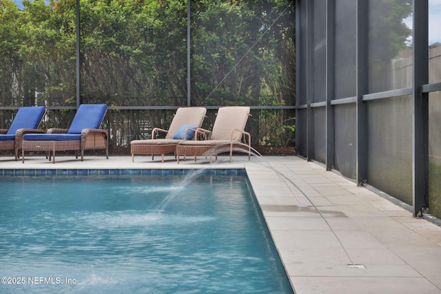 outdoor pool featuring a patio area and glass enclosure