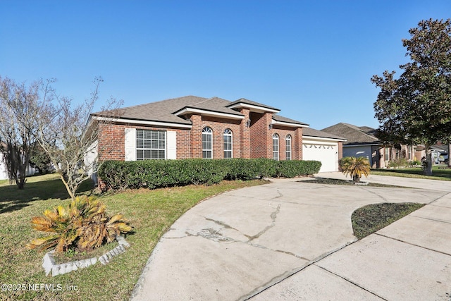 view of front of property with brick siding, a front lawn, concrete driveway, and a garage