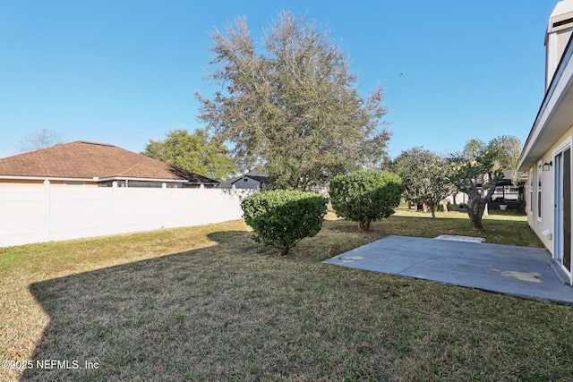 view of yard with a patio and fence