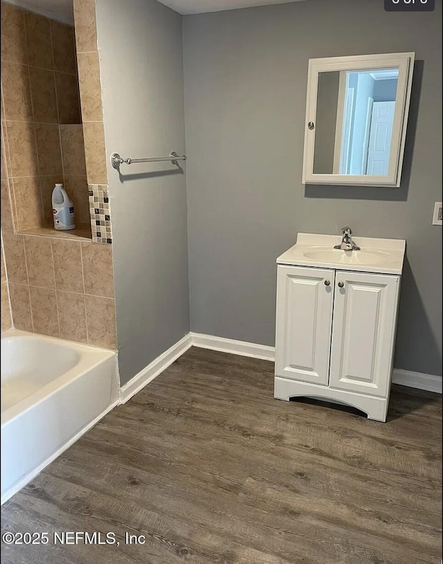 bathroom with vanity and wood-type flooring