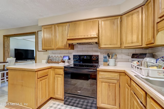 kitchen featuring a textured ceiling, a peninsula, light countertops, backsplash, and black electric range oven