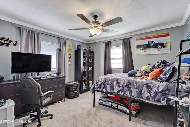 bedroom with ceiling fan, carpet flooring, and crown molding