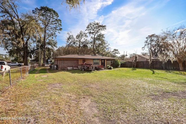 view of yard with a fenced backyard