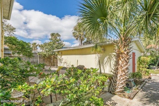 view of side of property with fence