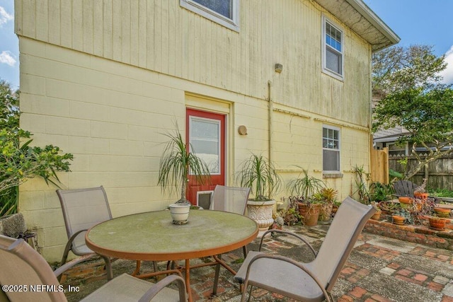 view of patio featuring fence